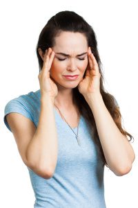 Close-up of a woman suffering from migraine or bad head ache. Isolated on white.
